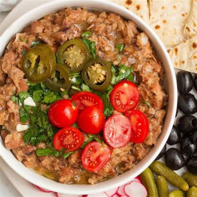  Ful Medames: Een romige boonenschotel vol kruidige aroma’s en texturen die je smaakpapillen zullen verleiden!